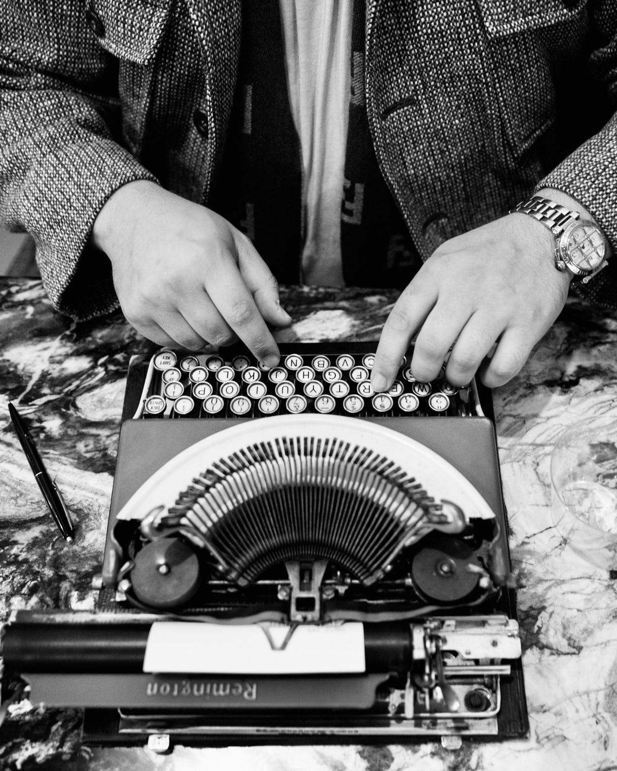 Paasha Motamedi's hands at the keys of a Smith-Corona typewriter